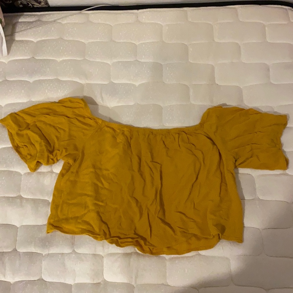 Yellowish orange off the shoulder crop top